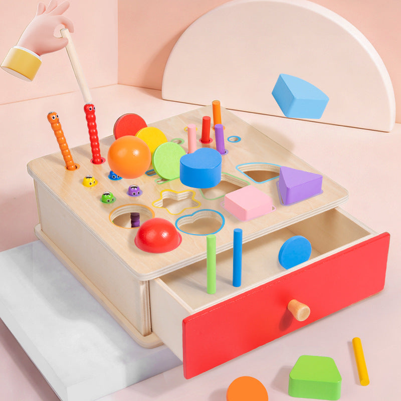 Wooden sorting box with colourful shapes, pegs and open red storage drawer