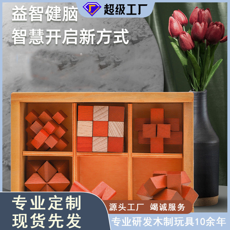Six wooden interlocking brain teaser puzzles displayed in compartmented box