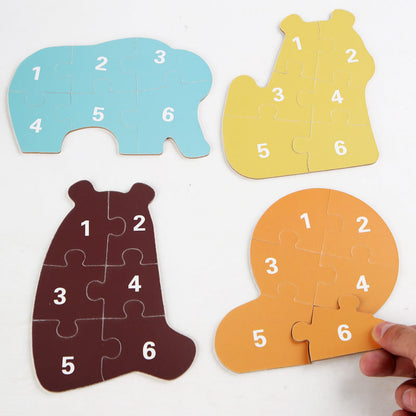 Numbered backs of six-piece wooden animal puzzles