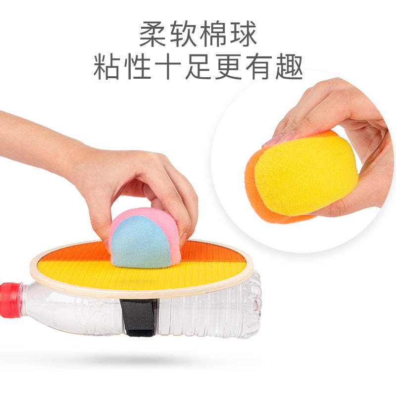 Soft fabric sticky ball attaching to the textured wooden paddle