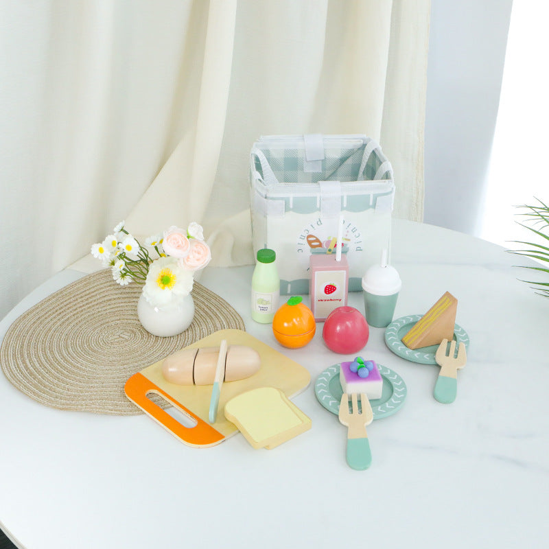 Picnic pretend play food and accessories arranged on a table