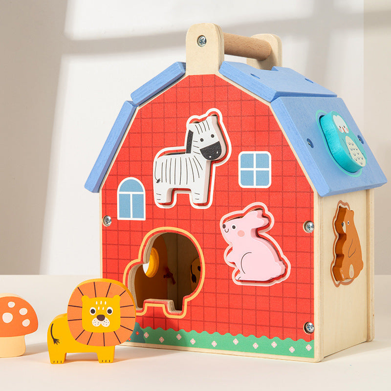 Portable wooden animal matching house with carry handle and shape sorter openings