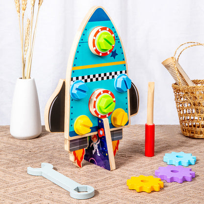 Blue wooden rocket screw toy with removable gears and tools