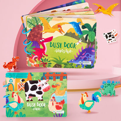 Dinosaur and farm busy books displayed together