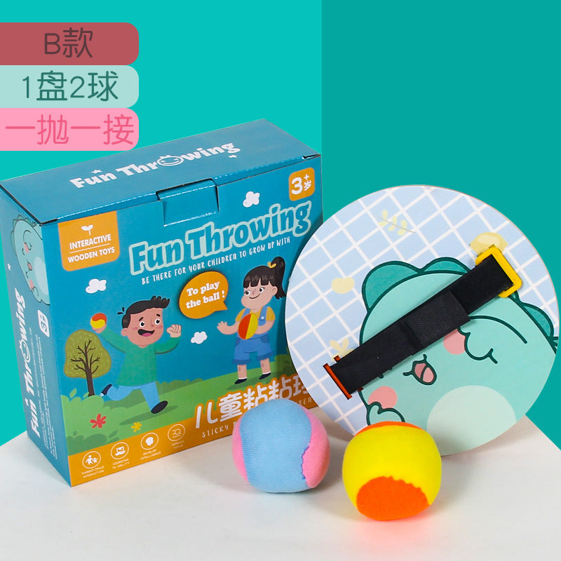 Wooden sticky ball toss and catch game with one paddle and two balls