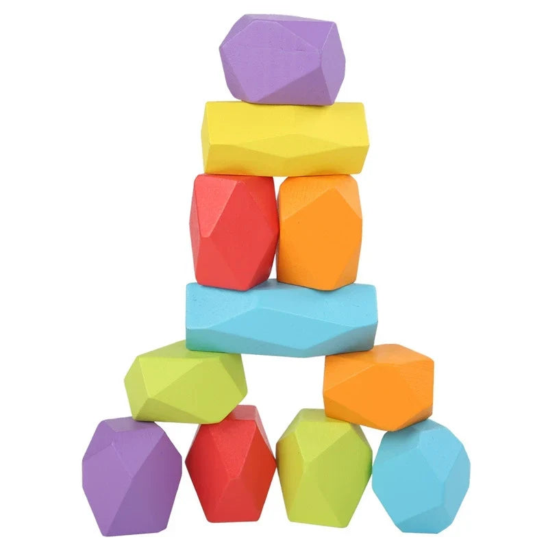 Colourful wooden balancing stone blocks stacked into a tower
